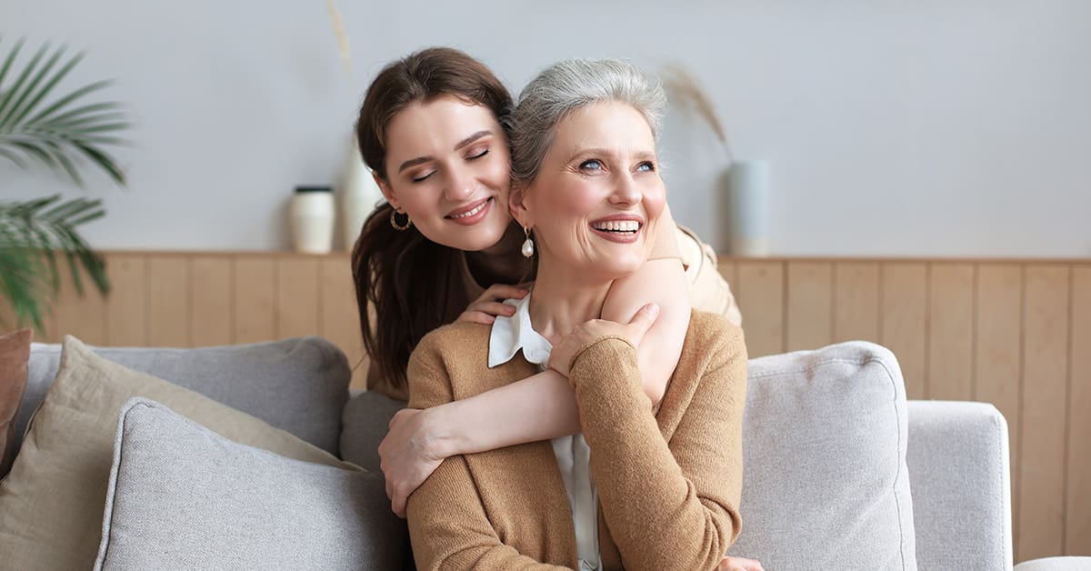 Are migraines hereditary? Mother and daughter on the couch